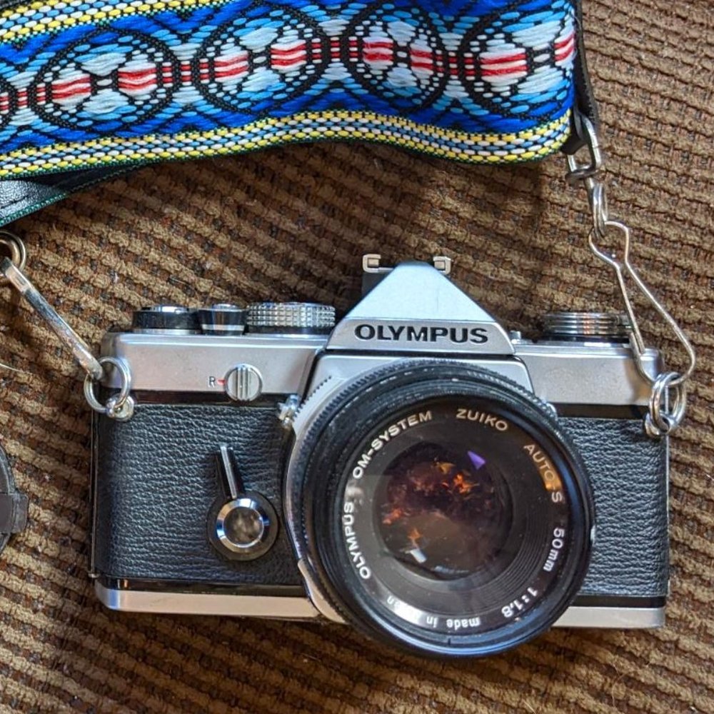Vintage OLYMPUS OM-1 35mm SLR Camera with Retro Strap